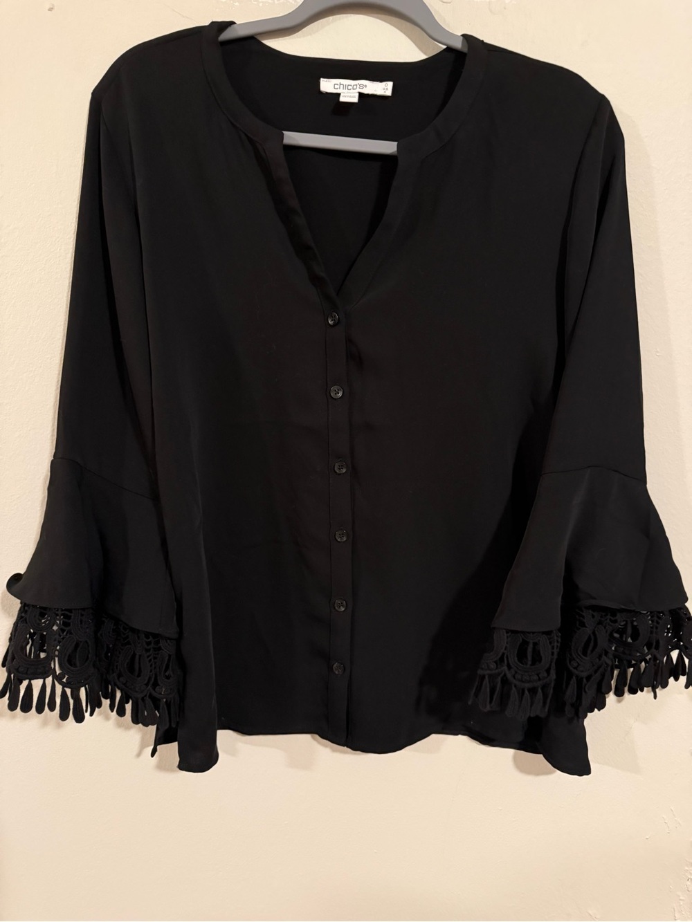 Chico’s Black Bell Sleeve Blouse w/ Crochet Tassel Detail Size 0 (US Small 4/6)‎